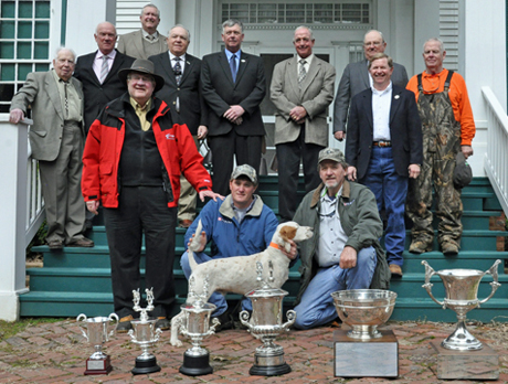 CH Shadow Oak Bo is posed at the conclusion of the 2013 National Championship with, from left to right, co-owner Butch Houston, scout Hunter Gates and handler Robin Gates.